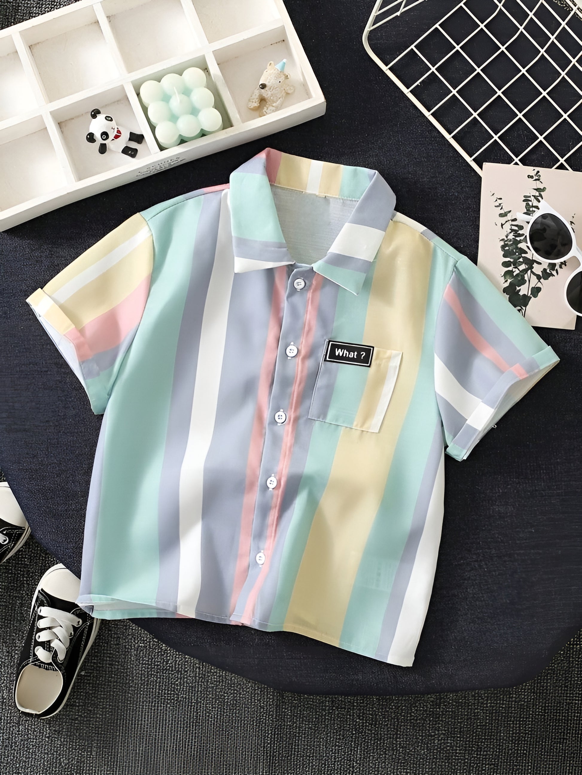 A multicolor striped cotton blend baby boy's shirt with a front button neckline, collar, and short sleeves laid out flat.